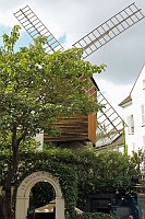  One of the original windmills once dominating the hillside of Montmartre, depicted in Renoir's 1876 masterpiece 