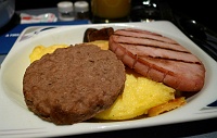  Sausage Patty, Ham Steak, Button Mushrooms, Cheese Omelette, and Potatos au Gratin - Continental Airlines First Class Breakfast Service