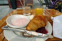  Hotel Buffet Breakfast: Strawberry Yogurt, Boiled Egg, and Croissant with Cherry Jam and Orange Juice