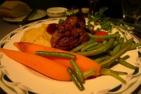  Braised beef short rib with red wine sauce, spicy aji amarillo mashed potatoes, fine green beans, baby carrots and cherry tomato