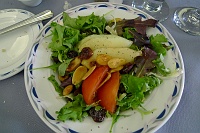  Mesclun salad mix with fresh tomato, sun-dried cherries, melon, almonds, and balsamic vinaigrette