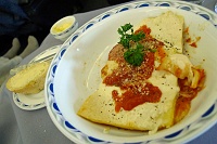  Cheese lasagne accented by pomodoro sauce offered with grated Parmesan Reggiano cheese