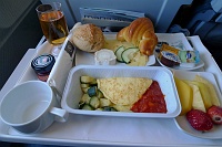  Business Class breakfast: Egg omelette with tomato sauce and zucchini, fruit salad, assorted cold cuts and bread