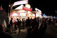  Spectators stroll the concessions south of the field just before Dawn Patrol