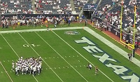  Texans huddle for a final time during pre-game before returning to locker roorm.