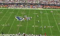  #90 Mario Williams turns the corner on the way to his first regular season sack as an outside linebacker in the Texans' new 3-4 defense.