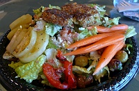  Crab cakes over lettuce with diced tomatoes, cucumbers, feta cheese, kalamata olives, roasted red pepper, pickled green tomatoes, pickled carrots, and citrus tarragon vinaigrette