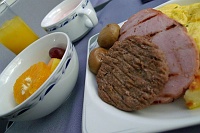  First Class Breakfast: turkey sausage patty, ham steak, egg omelette, fruit and yogurt