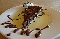  Dark chocolate pecan tart with fresh whipped cream and vanilla bean creme anglaise at Opal Restaurant & Bar, Santa Barbara