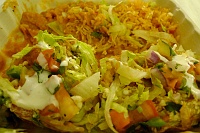  Homemade sopes: two homemade thick chicken corn tortillas topped with pinto beans, cheese, shredded chicken, lettuce, salsa roja, and sour cream with rice at Los Agaves, Santa Barbara