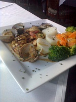  Special of the Day: Grilled fish in wine sauce with clams and grilled shrimp.  Served with potatoes, carrots, and broccoli