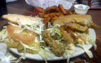  Lunch at Bear's Restaurant in Covington: Roast beef and gravy po-boy (left), soft shell crab po-boy (right), and sweet potato fries