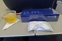  United First Class Snackbox, apple juice, and snack mix