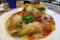  La Cueva Cafe - Taos, NM: Beef crispy taco, chicken enchilada, and chile relleno topped with red and green chile.  Served with rice and beans.