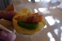  Bacon-wrapped shrimp atop avocado mousse on cracker