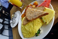  Omelette of crab, spinach, goat cheese, and onion with toast, breakfast potatoes, fresh fruit, and preserves at Brockton Villa in La Jolla