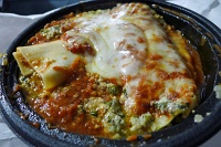 Fresh canneloni pasta stuffed with meat, minced spinach and three types Of cheese from Peppino's
