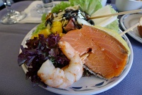  Appetizer of shrimp and salmon skewer with mango salsaa