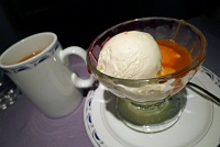  Ice cream with caramel and strawberry toppings and coffee