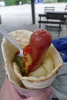 Tunnbröd wrap filled with hotdog, mashed potatoes, pickle relish, ketchup, and mustard
