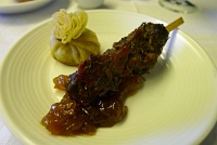  Vegetable/mushroom-filled pastry and lamb skewer with chutney