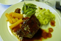  Tenderloin of beef with marsala wine sauce, potatoes, carrots, and sugar snap peas