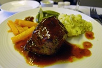  Tenderloin of beef with marsala wine sauce, potatoes, carrots, and sugar snap peas