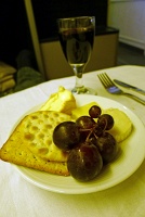  International cheese selection with grapes, crackers, and Graham's Late Bottled Vintage Port