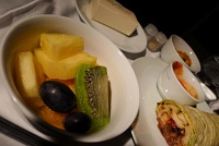 Fresh fruit salad of pineapple, kiwi, orange, and black grapes