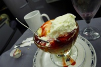  Ice cream with strawberry topping, caramel, and whipped cream
