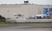  Cessna 177B on final approach to Paine Field in front of the Boeing Everett Factory