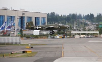  Old military aircraft on final approach to Paine Field in front of the Boeing Everett Factory