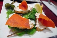  Smoked salmon rolls served with crabmeat and crispy crostini at Vino Volo, Seattle Airport