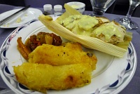  Tamale-filled breast of chicken with creamy corn sauce, grilled yucca, and tomatoes