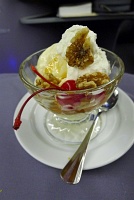  Ice cream with caramel, whipped cream, pecans, and cherries