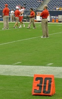  UH head coach Tony Levine in the background
