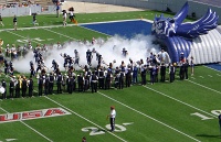  Rice football team emerges from smoke-filled owl tunnel