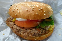  Angus cheeseburger: Premium Angus beef with melted cheese, lettuce, tomato, pickles and onion, served with traditional condiments