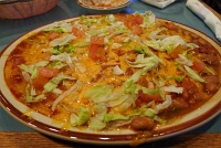  Cheese enchiladas with red and green chile and beans at Sadie's of New Mexico