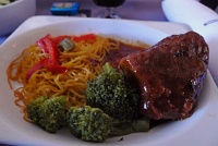  First Class dinner: Asian short ribs with noodles and broccoli