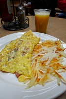  Ham, cheese, and tomato omelette with hashbrowns and orange juice at Embassy Suites Denver-Aurora