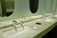  Sinks with aircraft cabin window-style mirrors, T-2 United Club at ORD