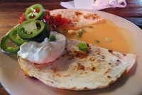  Smoked Duck Quesadilla at Coop's Place, served with sour cream, fresh salsa and jalapenos