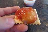  Raw oyster on cracker with sauce at Felix's