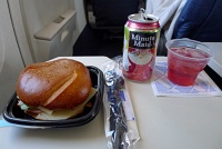  Ham and cheese sandwich on pretzel roll with cranapple juice on United