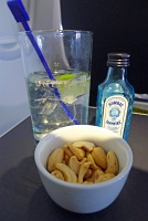  Gin and tonic with warm nuts on United