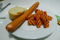  Plate of pasta, sausage, and bread with garlic spread - Lufthansa Senator Lounge, Frankfurt Airport