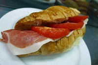  Cured ham with fresh tomato on a croissant, Madrid