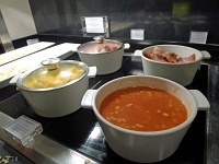  Hotel Gran Melia Colon breakfast buffet, Sevilla: bacon, baked beans, scrambled eggs, and sausage