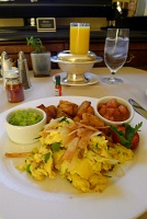  Misson migas (scrambled Red Hills free range eggs, jalapeño cheddar, chorizo, crisp tortilla, guacamole) with Orange Juice - Fairmont San Francisco Hotel